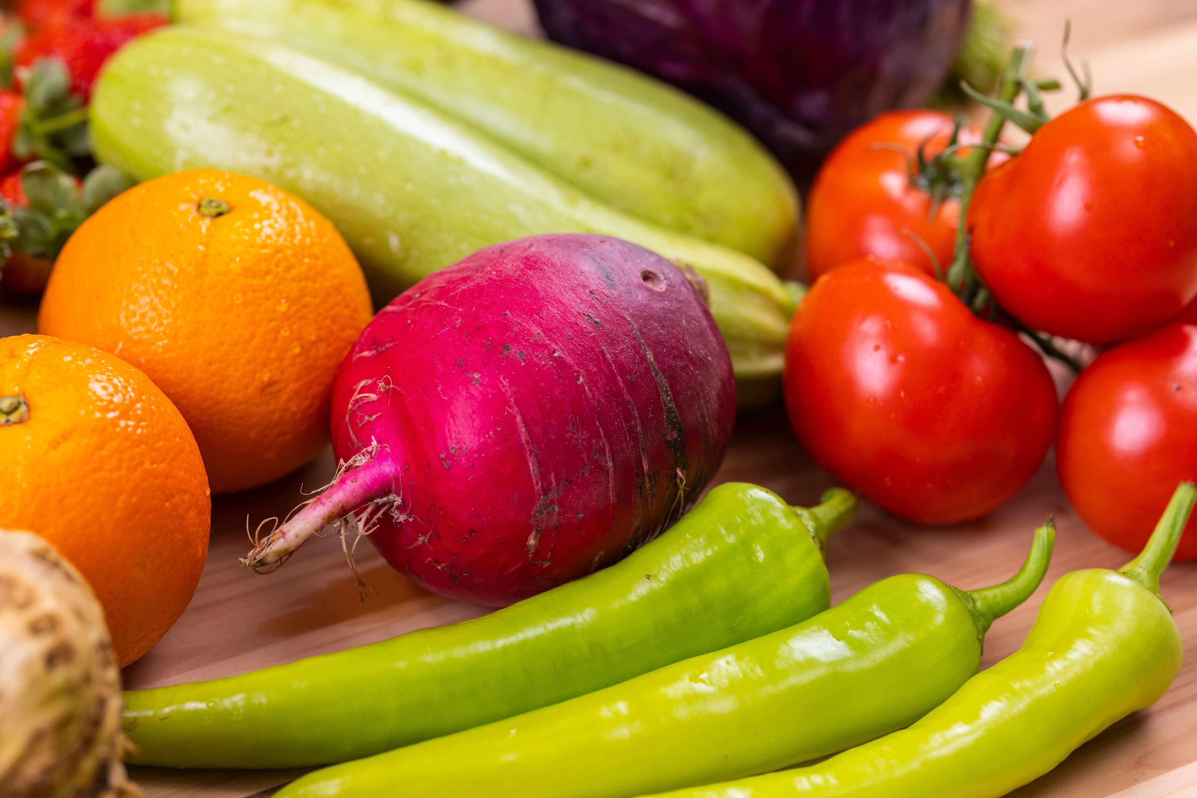 A colorful mix of fresh fruits and vegetables, showcasing organic nutrition.